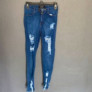 Akira jeans with shredded rips